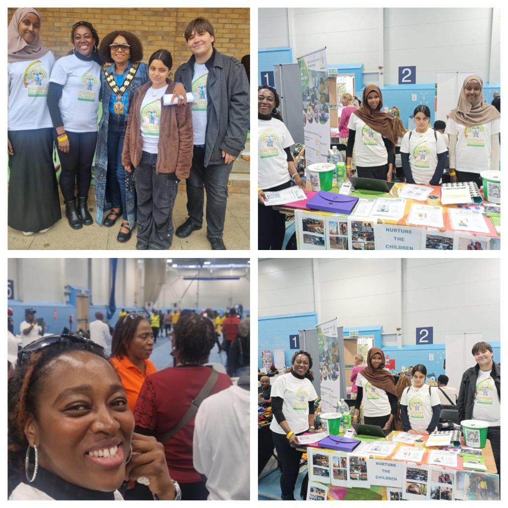 Four photos showcasing a community event. The top left photo shows a group of people standing outside, some wearing t-shirts with a logo that says "Nurture the Children." The top right photo depicts a booth with a banner that reads "NURTURE THE CHILDREN" and several people behind a table displaying information and brochures. The bottom left photo is a close-up of a smiling woman, with a blurred background of a crowded indoor venue. The bottom right photo shows a similar booth to the top right one, also with the "NURTURE THE CHILDREN" branding and people interacting at the table.